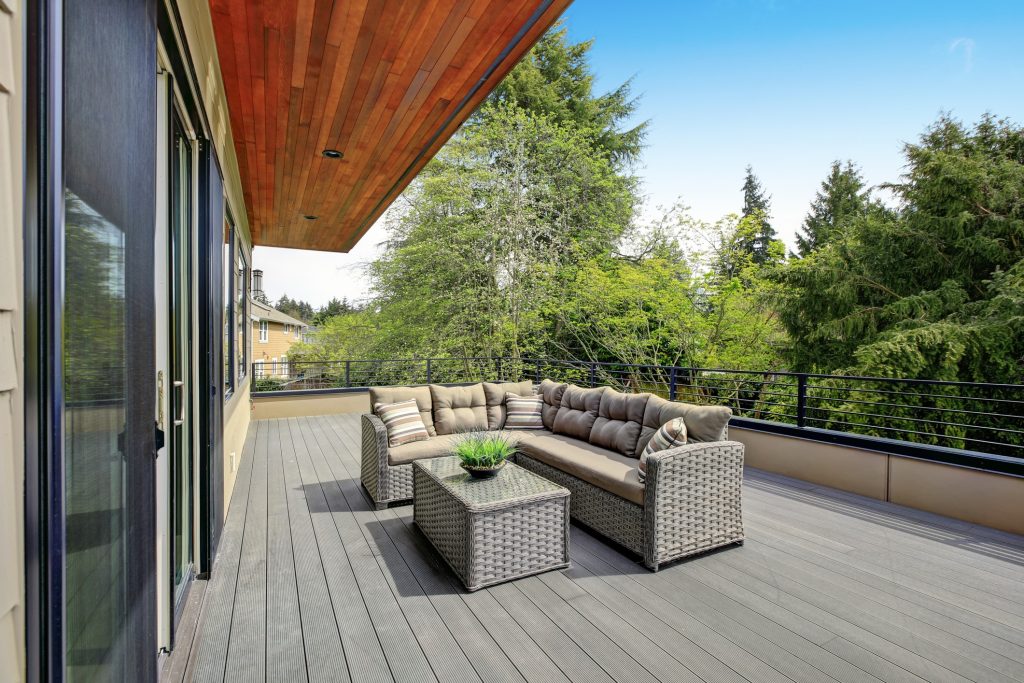 A modern outdoor deck complete with contemporary outdoor furniture.